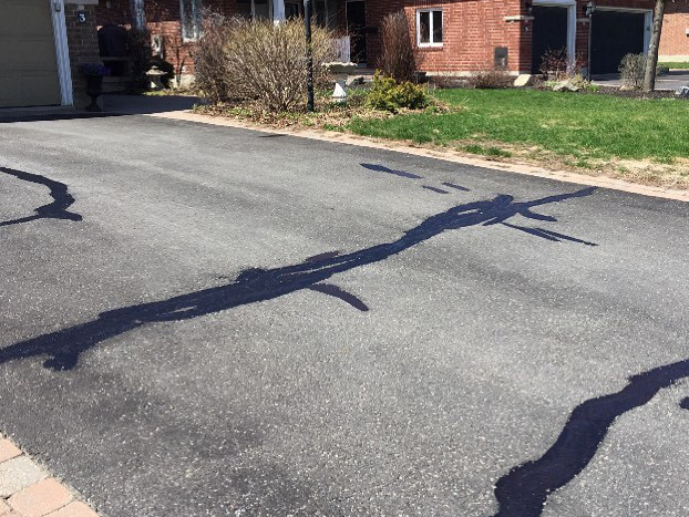 photo of driveway asphalt cracks repaired