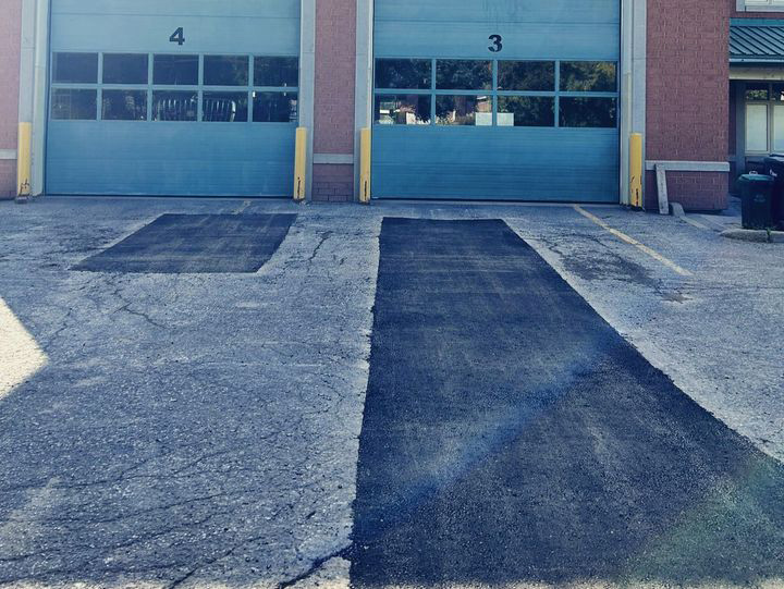 asphalt repair on fire station entry