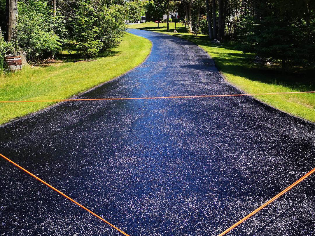 asphalt sealing on a long driveway